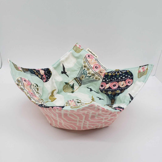 Microwavable bowl cozy with whimsical hot air balloon print and floral back for heat protection and style